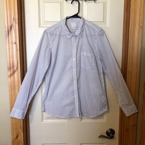 Navy polka dot blouse.